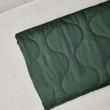 Tissu matelassé "Thelma Thermal Quilt/Wave - bottle green" (vert foncé) de mind the MAKER